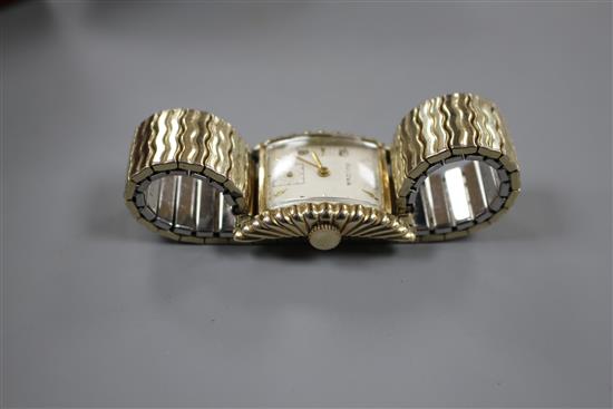 A gentlemans 1950s 10k gold filled Bulova Westover clam shell cased manual wind wrist watch.